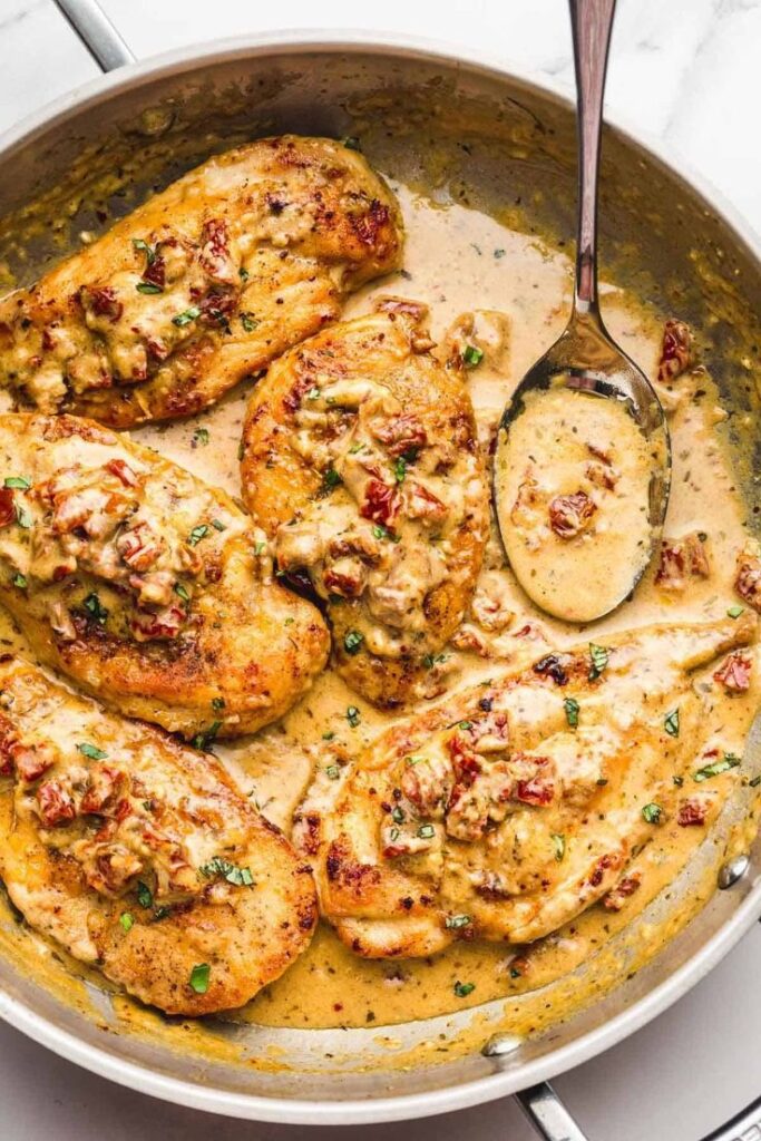 Delicious tuscan chicken dish, in a golden creamy sauce with sundried tomatoes